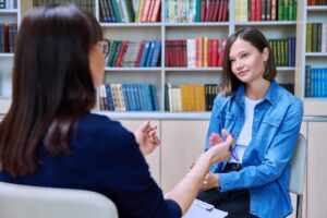 a-teen-girl-speaking-to-her-mentor-scaled